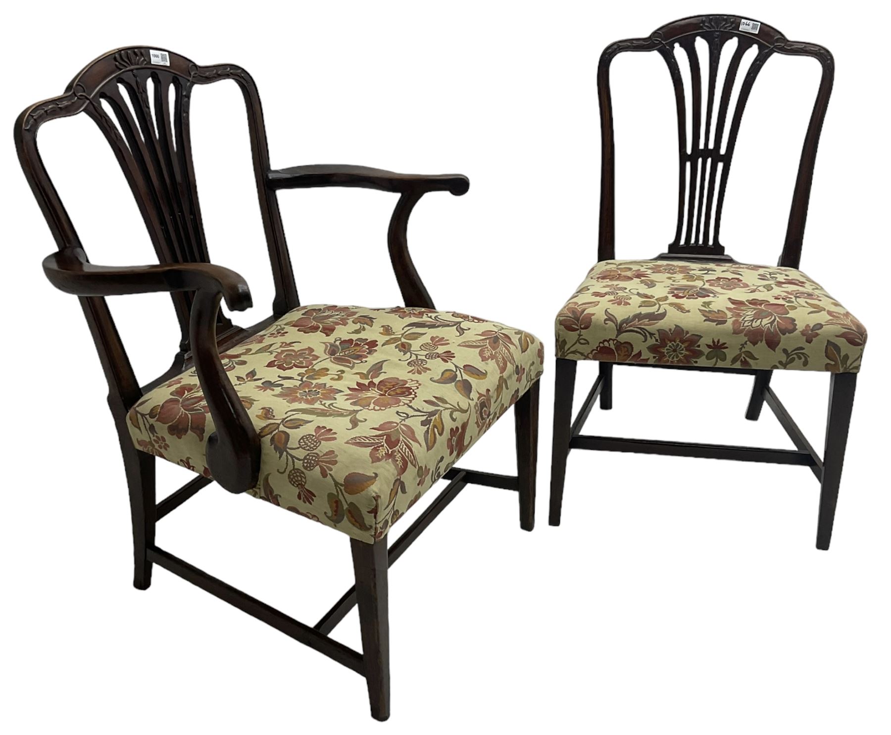 George III Hepplewhite design mahogany elbow chair and matching side chair, cresting rail carved with bellflowers over pierced and flared splat, seats upholstered in floral patterned fabric, raised on square tapering supports united by stretchers
