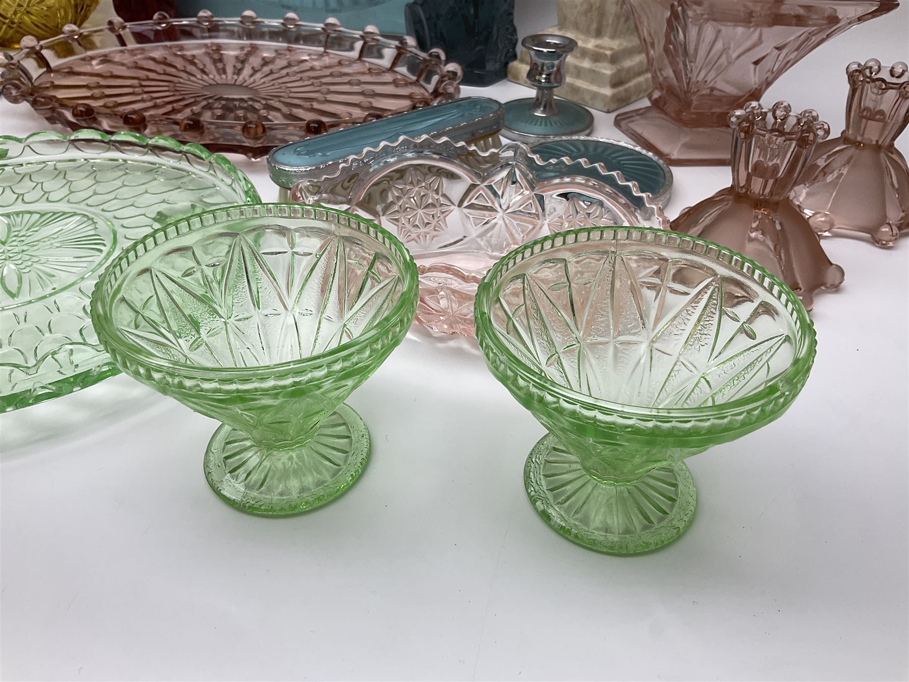 Swedish Svenskt Glass limited edition blue glass salmon, modelled by Paul Hoff, together with two vintage moulded coloured glass dressing table sets with jars and trays, spinning shot glass holder with abstract design glasses and an Art Deco vase, etc 