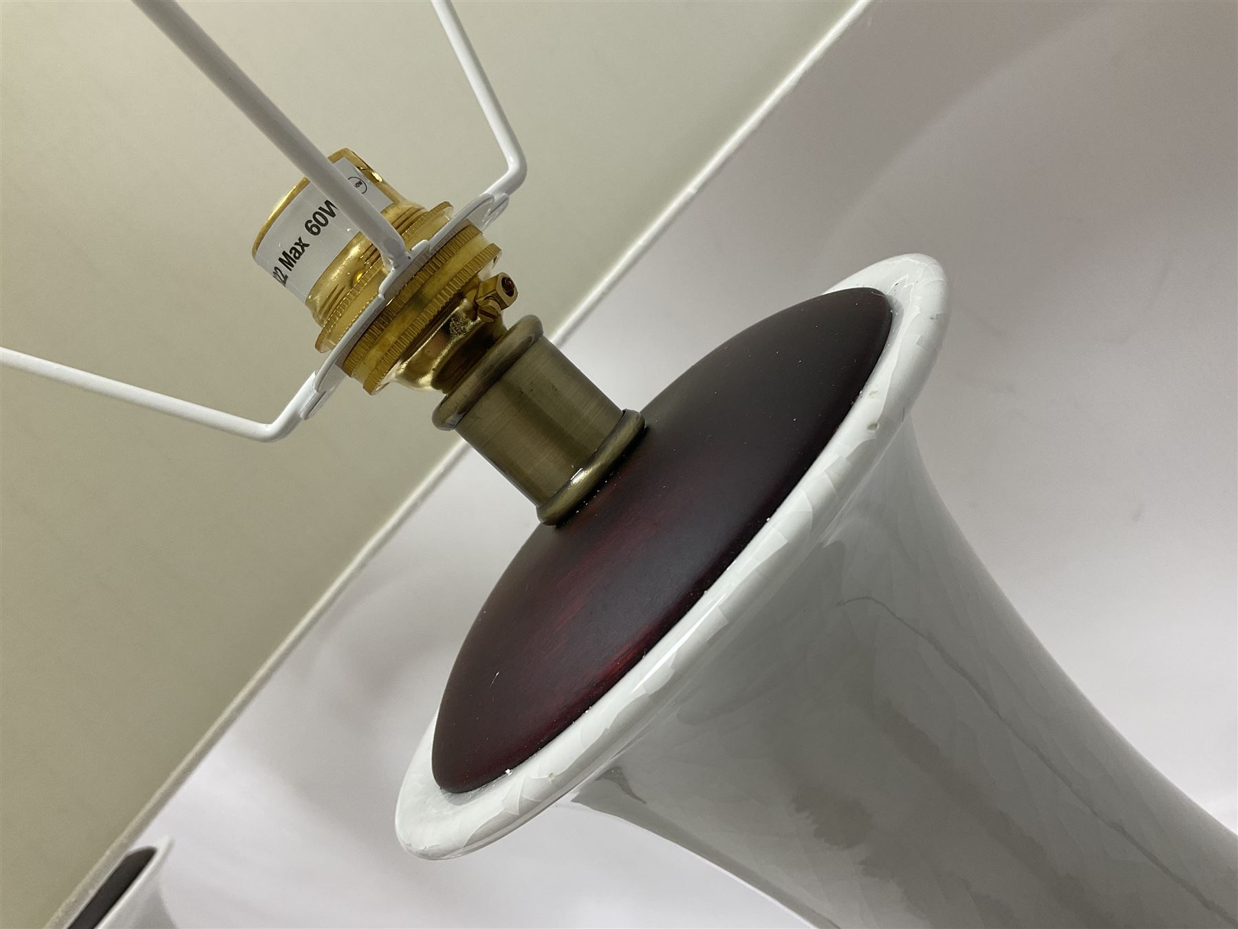 Pair of Chinese ivory crackle glazed table lamps, each of bottle form, raised upon circular hardwood base, excluding fittings H43cm