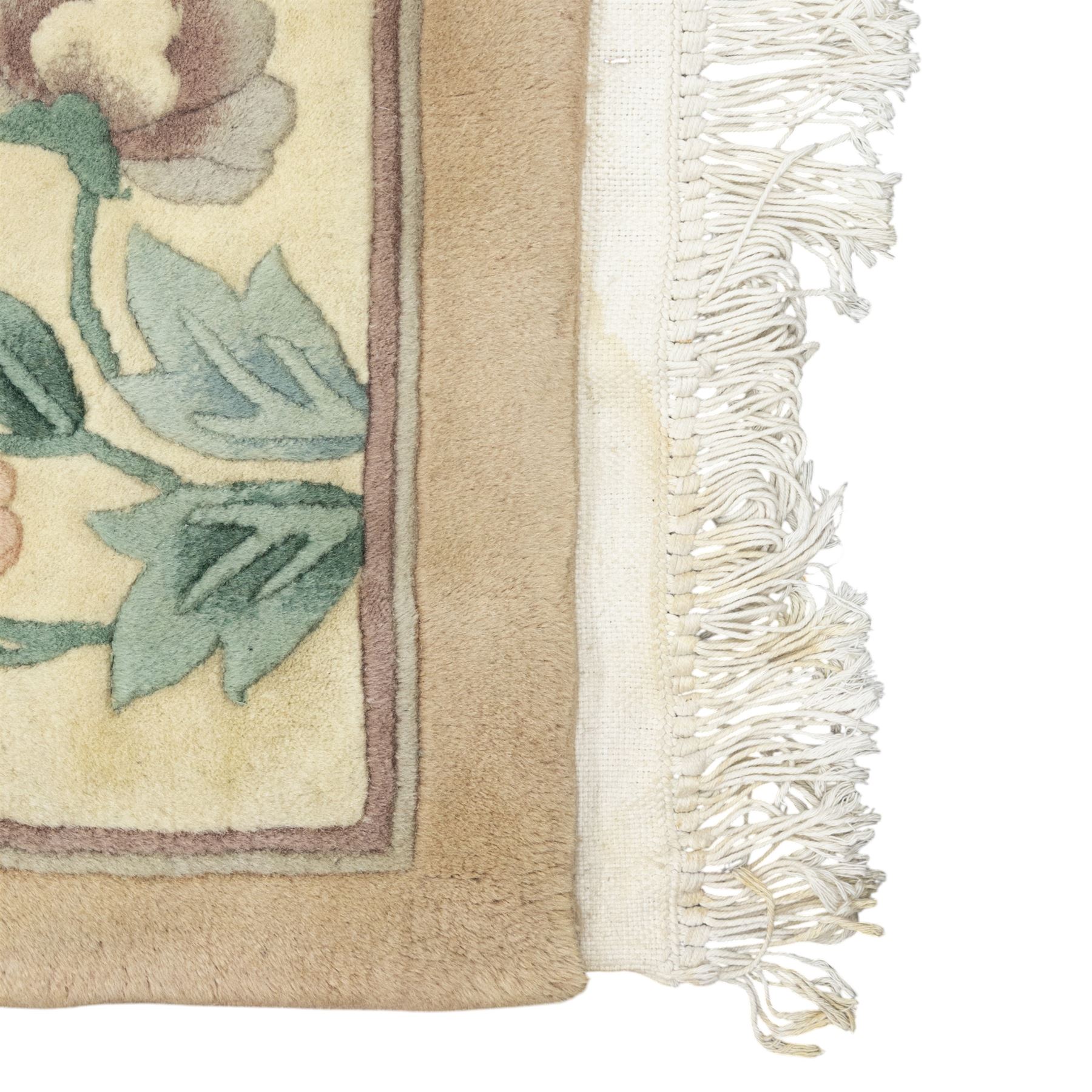 Chinese wool rug, beige ground decorated with peonies, flowering branches and butterflies, centred by a shou symbol within key pattern surround, cream border with floral sprays and double happiness motifs, cotton fringe ends