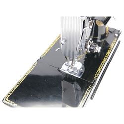 Singer 221K electric sewing machine, with case and accessories