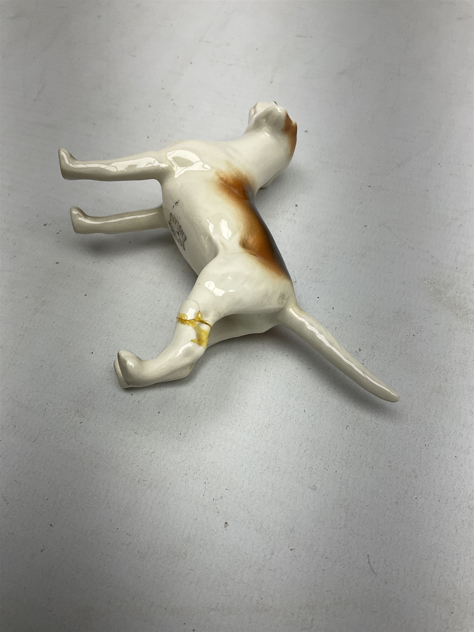 Beswick hunting group, comprising huntswoman on grey horse no 1730, huntsman on brown horse no 1501, two seated fox figures no 1748 and seven fox hounds, all with printed marks beneath (11)