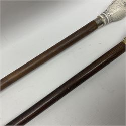 Two walking sticks, the first example with pommel modelled as an owl, the second example with pommel modelled as a hunting dog, tallest L90cm
