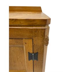 Rabbitman - adzed oak sideboard, fitted with three central drawer and two flanking cupboards, panelled doors with iron latches and hinges, carved with rabbit signature, by Peter Heap, Wetwang