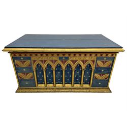 In the manner of William Burges - mid-to-late 19th century English Gothic Revival pine altar or console table, in blue and red paint with water gilding, the moulded rectangular top over six pointed arches with turned column supports, the front carved with a single row of lozenges and incised stylised motifs