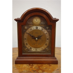  Elliott mahogany cased mantel clock retailed by Asprey & Co, of small Georgian bracket clock form, the arched brass dial with Tempus Fugit plaque over a silvered chapter ring with Roman numerals and mask head spandrels enclosing a fixed key wind eight day movement, H17cm excluding carrying handle, presentation plaque to back  