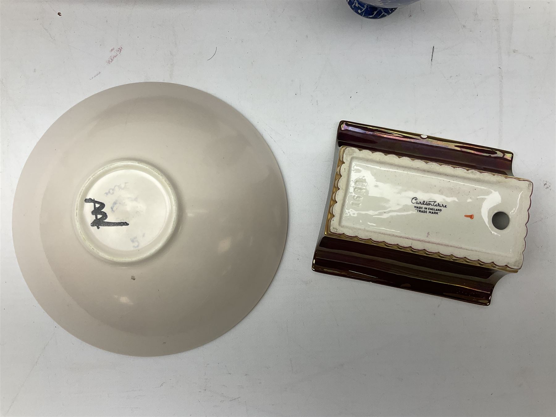 Shelley Cloisonne pattern vase, Carlton Ware Rouge Royal pattern twin handed dish and ash tray decorated with pagoda and Poole Delphis shallow bowl with geometric decoration on orange ground, largest L28cm