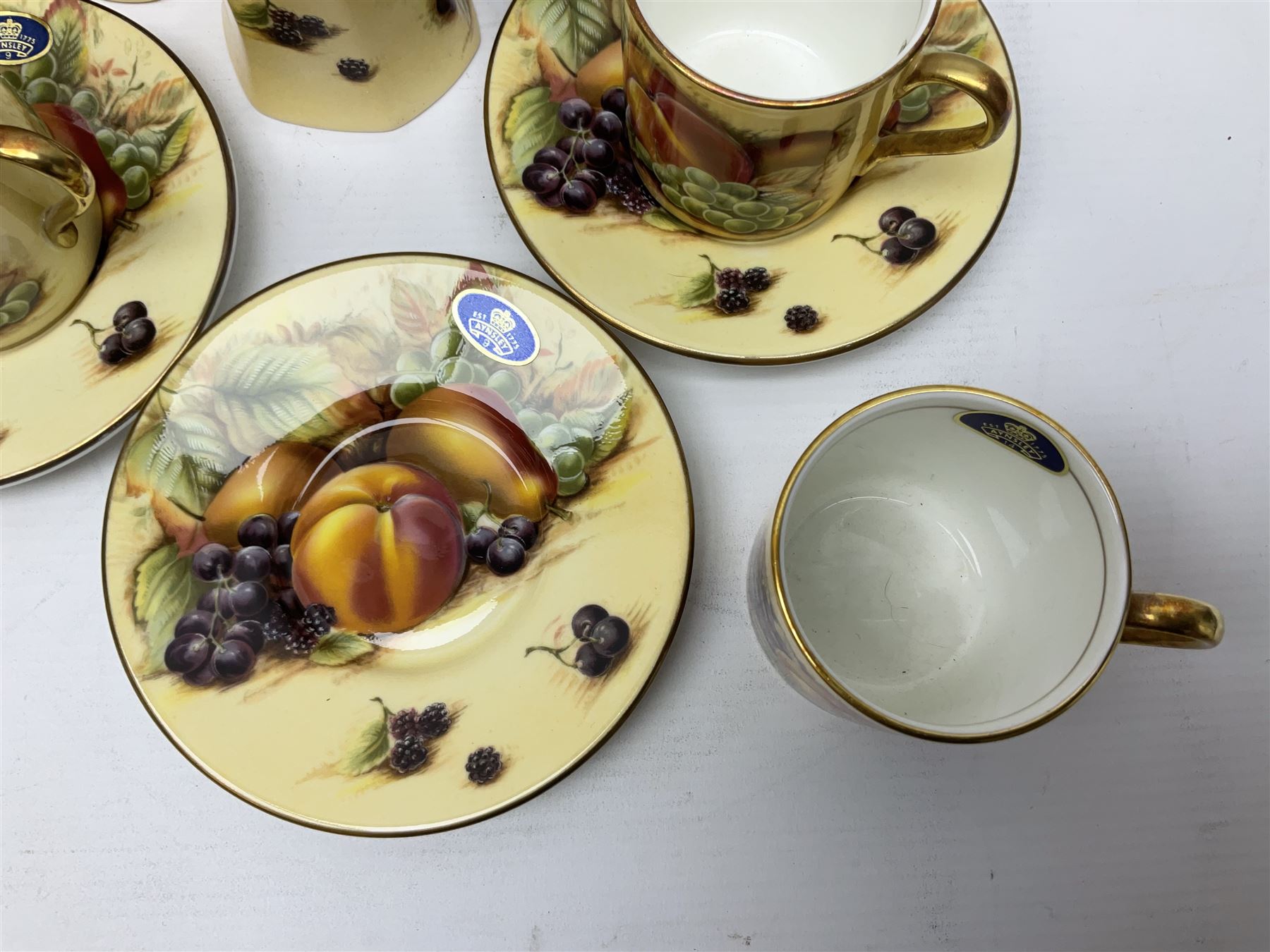 Aynsley Orchard Gold five coffee cans and saucers, mantel clock, plate etc 