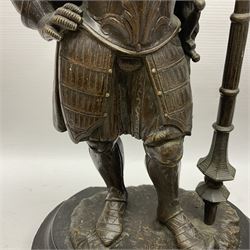 Pair of bronzed figure modelled as a hunter in traditional dress, each holding a pike, H48cm
