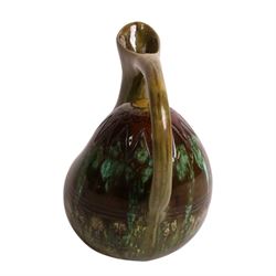 Dr Christopher Dresser - Linthorpe pottery hump back water jug with incised and green glazed decoration and loop handle, facsimile signature and numbered 347 H17cm