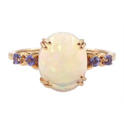 9ct rose gold single stone opal ring, with tanzanite set shoulders, hallmarked