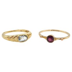 Early-mid 20th century 9ct gold single stone garnet ring and a later 9ct gold single stone aquamarine ring