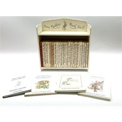 'Peter Rabbit's Book Shelf', containing selection of Beatrix Potter books, mostly library editions, shelf H29cm L27.5cm D11.5cm