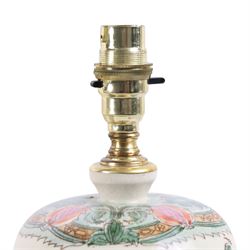Pair of table lamps, decorated with foliate patterns upon a cream ground, H48cm