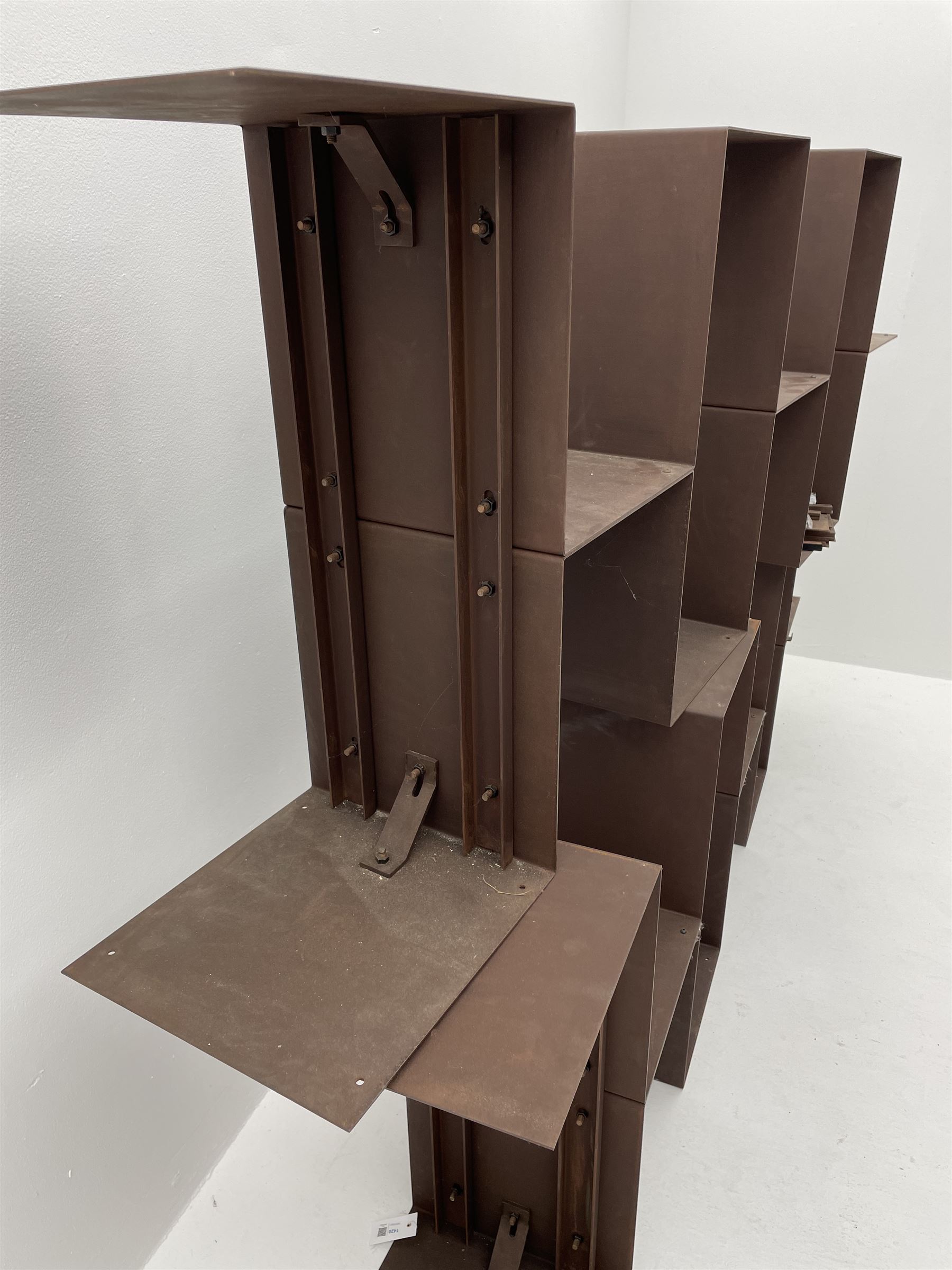 Retailed by The Conran Shop - four sectional modular shelving units, rusted metal finish, each unit - W212cm, H71cm, D33cm