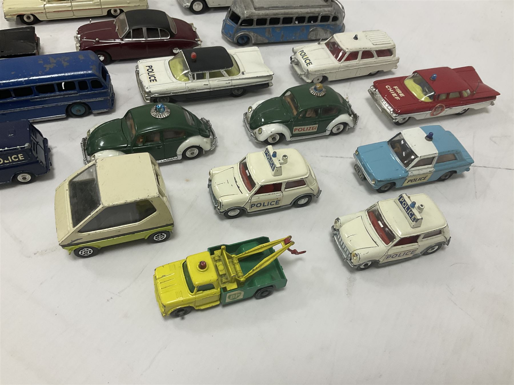 Corgi/Dinky - twenty-four unboxed and playworn die-cast models, predominantly emergency vehicles and buses; including Autocar Isobloc, Superior Criterion Ambulance, Ford Transit Police Vans, Chevrolet Impalas, Minissima, Ausin Mini Police van etc (24)