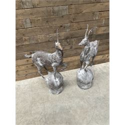 Pair of cast iron garden Stag figures or gate finials, raised on spherical ribbed base 