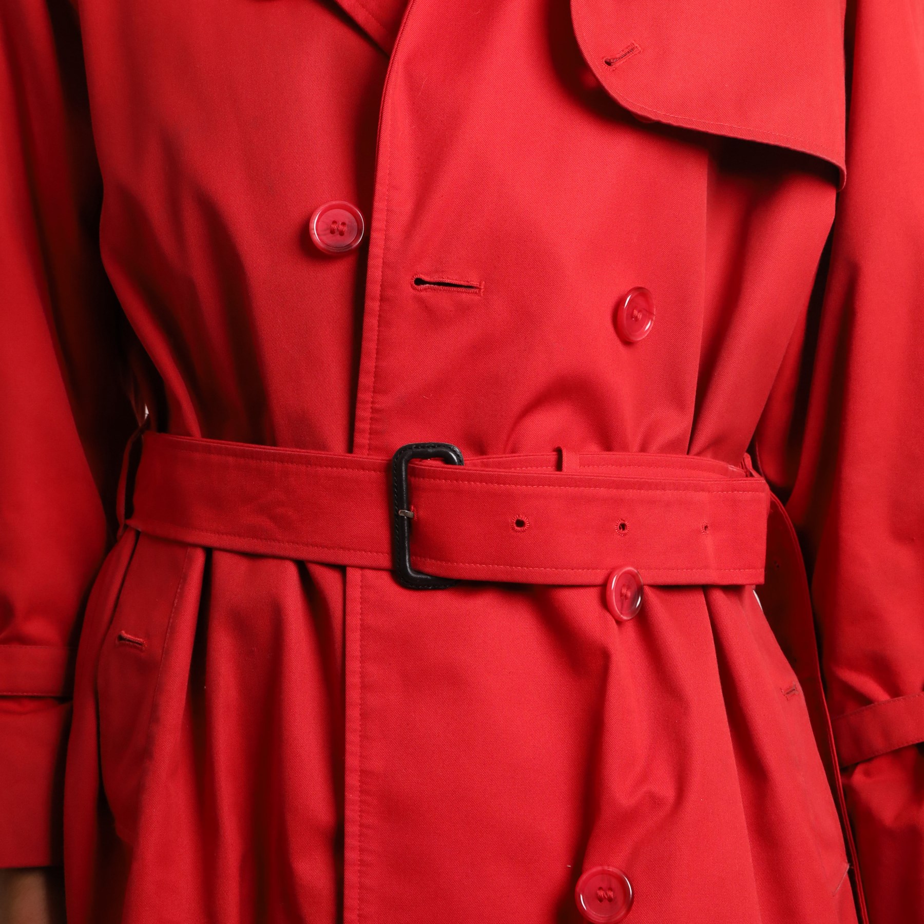 Burberrys and Aquascutum - two vintage trench coats, comprising a Burberrys red cotton trench coat with navy, red and grey check lining, labelled Burberrys, Made in England, and an Aquascutum beige cotton trench coat with house check lining, labelled Aquascutum, Made in England, both size L (2)
