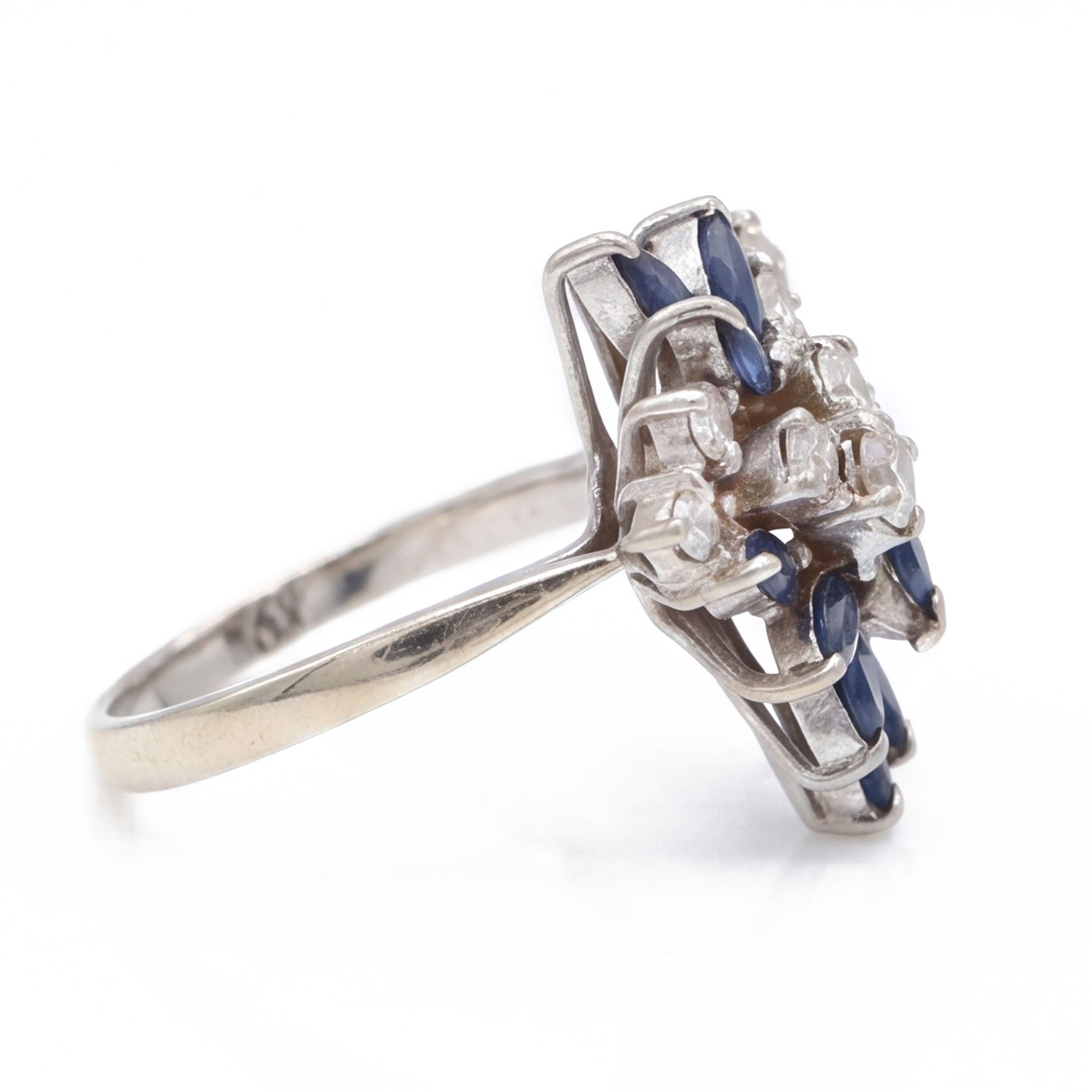White gold sapphire and diamond cluster ring, set with eight round brilliant cut diamonds and twelve marquise cut sapphires, stamped 18ct, total diamond weight approx 0.45 carat
