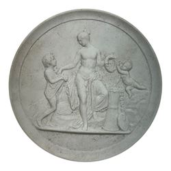 Seven plaster medallions within a wooden frame, together with another framed medallion, pair of Royal Copenhagen bisque porcelain circular plaques and two other plaques  