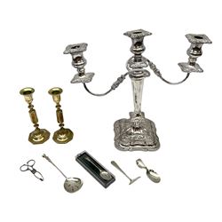 Hallmarked silver spoon, marked Pamela with the terminal in the form of a man, together with hallmarked silver sugar nips with shell bowls, pair brass candlesticks, Viner's candelabra and three other silver plated items