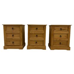 Pair of pine three drawer bedside chests, black iron handles
