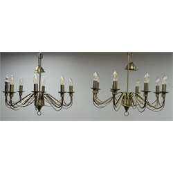  Two brushed brass eight branch chandeliers, H54cm W59cm and two rope twist brushed brass lamps with cream shades, H50cm  