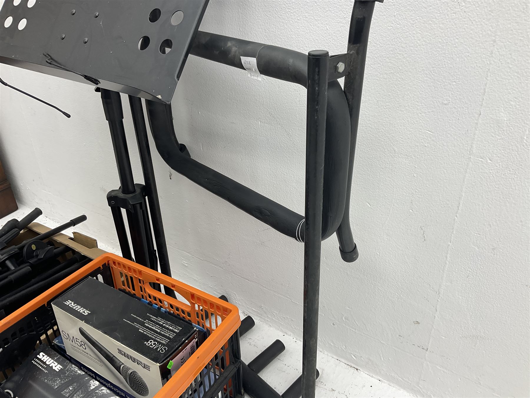 Two Shure SM58 microphones, Gatt Audio DM-700 microphone, other boxed and unboxed microphones and various microphone and music stands