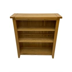 Light oak bookcase, fitted with two shelves