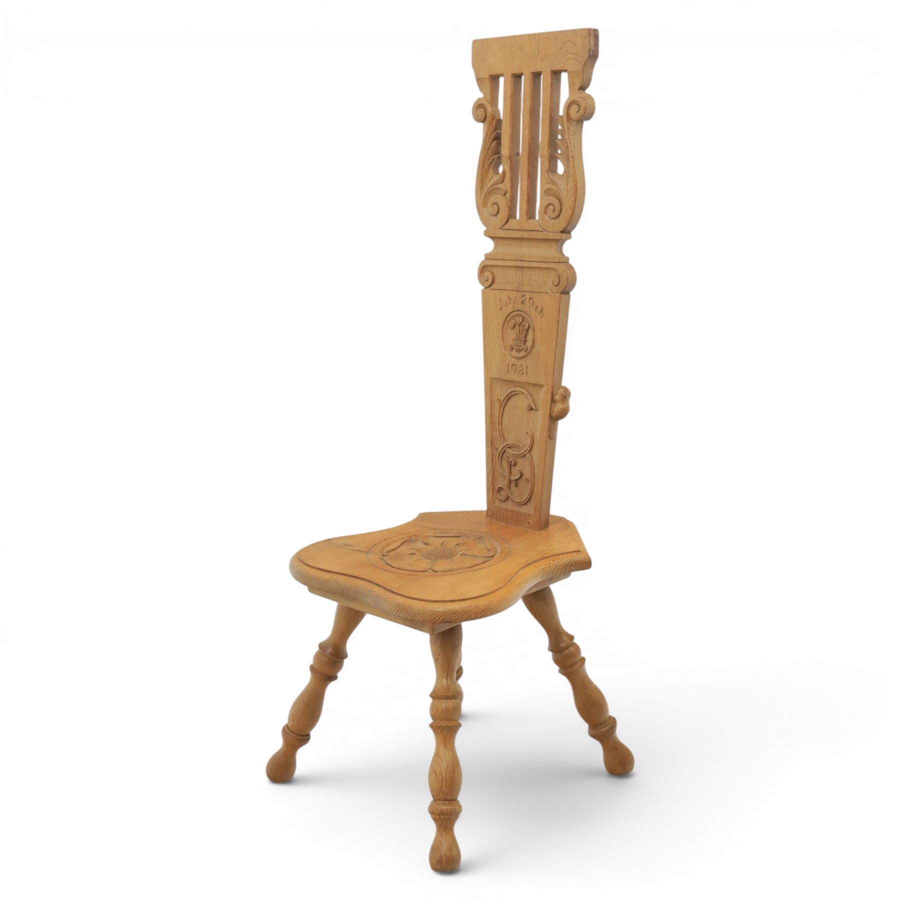 Beaverman - Oak hall chair with commemorative carved back panel  dated '29th July, 1981' for Prince Charles and Princess Diana royal wedding, with carved Yorkshire rose and the Prince of Wales feathers, on turned supports, with carved beaver signature, by Colin Almack of Sutton near Thirsk
