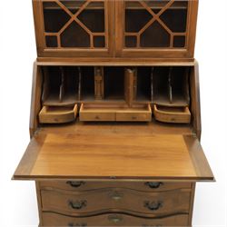 Maddox of Jamestown New York - Georgian design mahogany bureau bookcase, broken arch pediment with central finial, astragal glazed bookcase, above a fall front writing slope with fitted interior, four serpentine drawers, raised on claw on ball feet 
