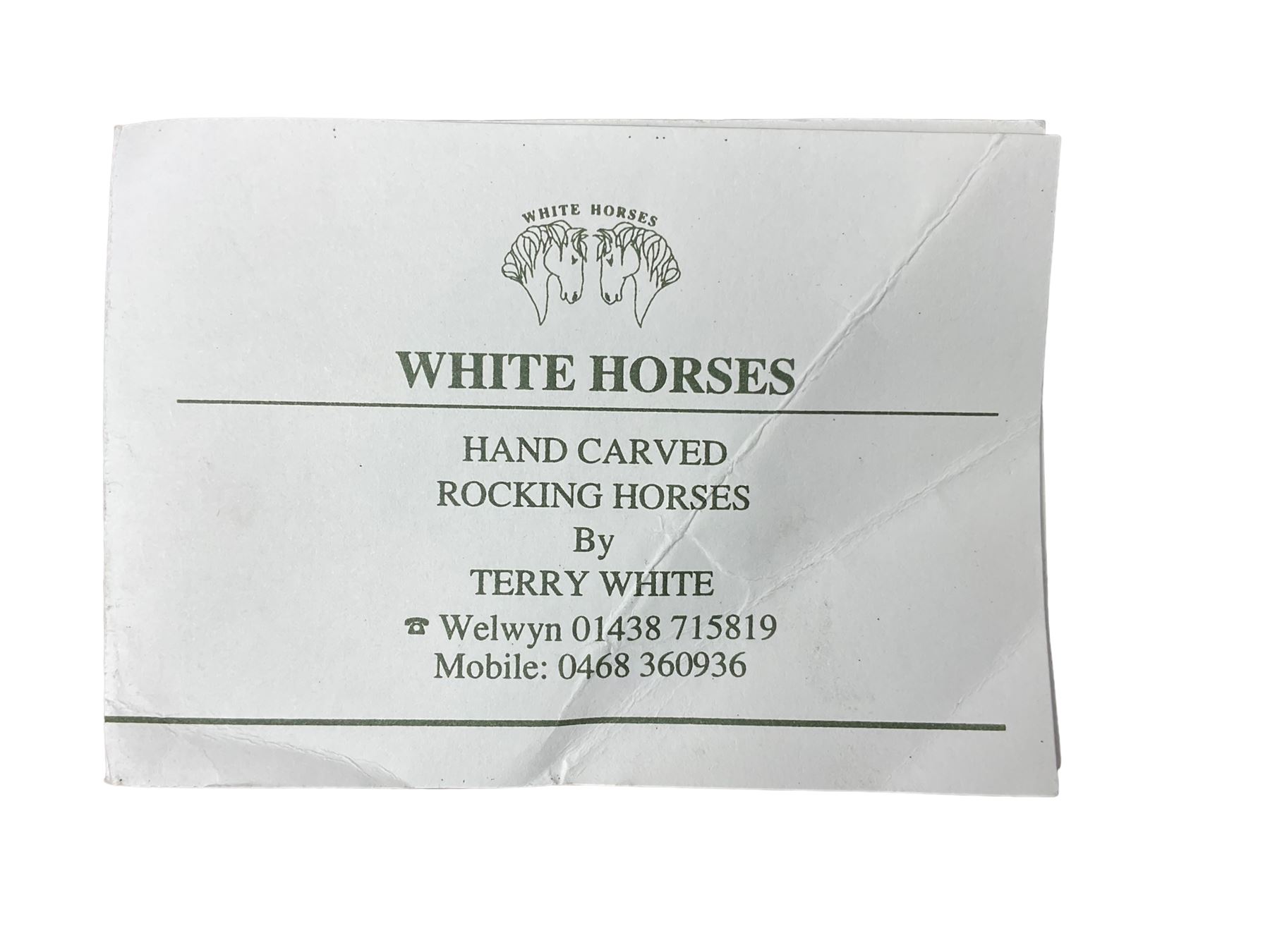Terry White for White Horses (Hertfordshire 20th century) - Carved pine rocking horse, raised on a pine trestle base