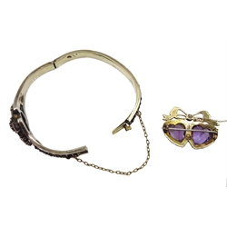 Edwardian gold amethyst and split pearl, double heart design brooch, stamped 9ct and a Victorian silver bohemian garnet hinged bangle, makers mark WJP