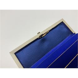 Victorian mother of pearl tea caddy, of rectangular bow-fronted form, the body with floral, bird and geometric engraved mother of pearl panels, white metal shield plaque to the cover inscribed with the initials G.J.A and similar escutcheon, the two division interior with ivory edging and two panelled mother of pearl lids, on four vegetable ivory bun feet L20cm, together with a similar style mother of pearl card case (2) This item has been registered for sale under Section 10 of the APHA Ivory Act