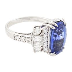 18ct white gold Ceylon sapphire and diamond dress ring, single oval cut sapphire of 4.65 carat, either side set with round brilliant cut and baguette cut diamonds and diamond set shoulders, stamped 750, total diamond weight 0.77 carat, with World Gemological Institute report