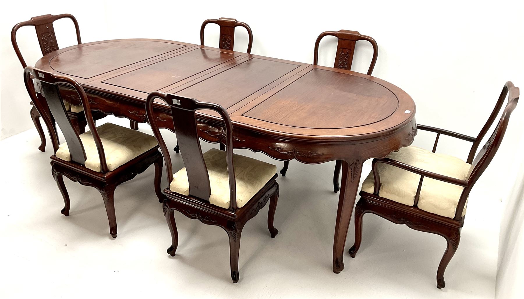 Chinese rosewood extending dining table, two leafs, shaped apron, carved, reed and tapering supports (W246cm, H78cm, D117cm) and set six (4+2) dining chairs, shaped cresting rail, carved splat, upholstered seat, tapering supports (W57cm)