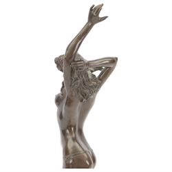 Bronze figure of a dancing nude female after Aldo Vitaleh, with signature to base, upon a black marble effect plinth, H55cm