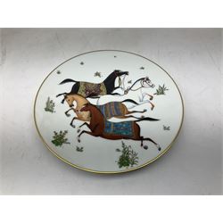 Hermès 'Cheval d'Orient' plate, decorated in the style of Persian miniatures with whimsical design of four leaping Arabian horses with colourful saddle pads and gilt, with Hermes marks beneath, D21cm