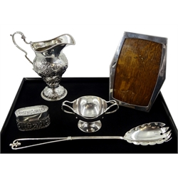 Edwardian silver cream jug, embossed floral decoration by Goldsmiths & Silversmiths Co Ltd, London 1902,  silver mounted oak photograph frame, Birmingham 1918, Victorian silver salad server by Thomas Latham & Ernest Morton, silver twin handled salt and silver ring box, both hallmarked