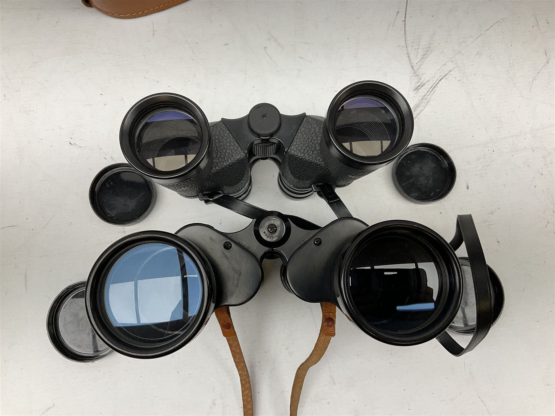 Nine cased pairs of binoculars, to include Embassy 8x40, Tasco 7x35, Zenith 10x50 Field. Opticron 10x50, Swift 8x40 Grand Prix Mk I, etc