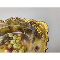 Pair of early 20th century Royal Worcester dishes decorated by Frank Roberts, each of oval form with gilt shaped rim and twin shell handles, hand painted with a still life of fruit upon a mossy ground, signed F Roberts, with puce printed mark beneath and date code for 1918, W31cm