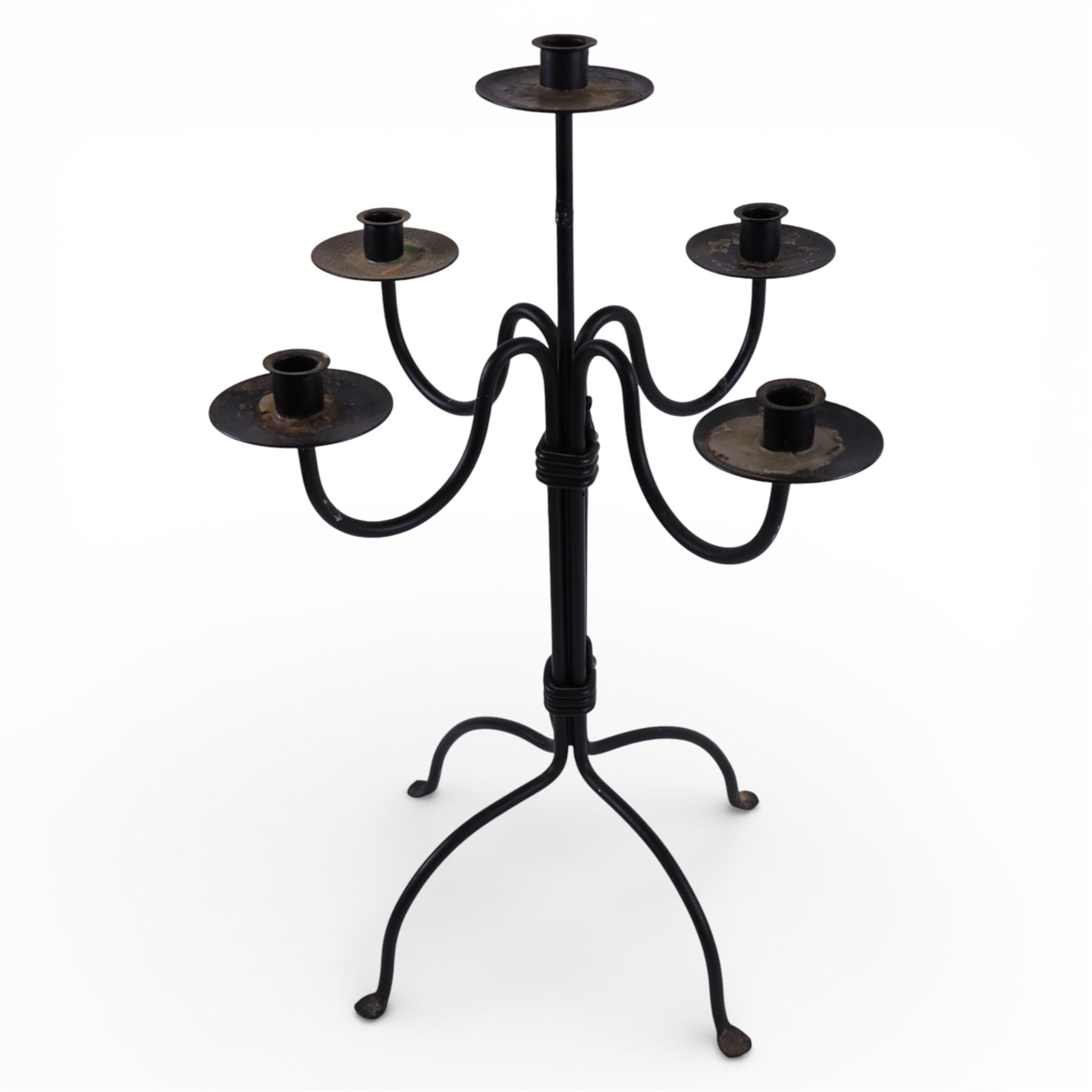 Black metal four branch candelabra, H56.5cm, together with a wrought iron style picket candlestick upon three feet, H45.5cm, and a further four branch example, H39cm