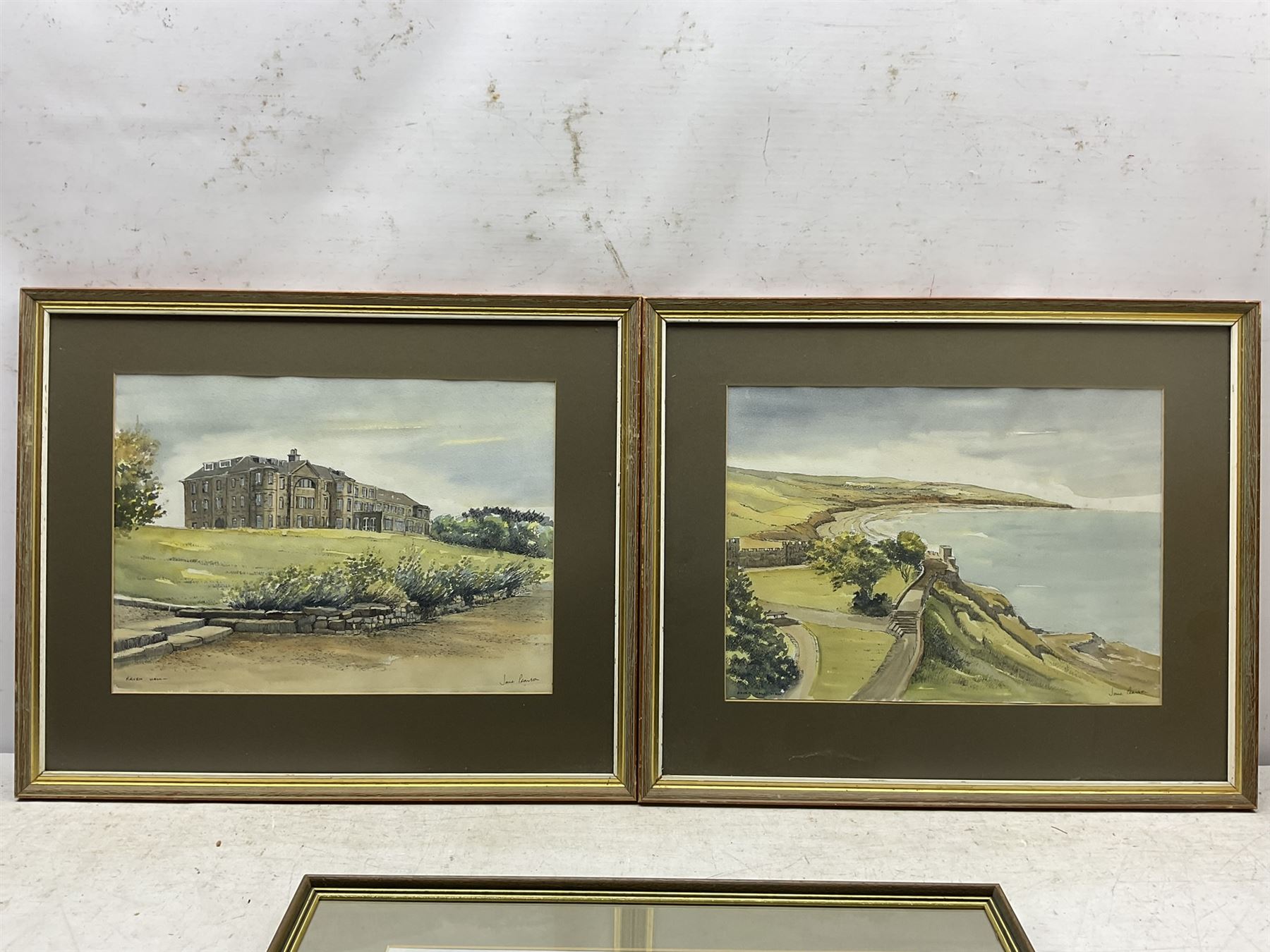 Jane Pearson (Yorkshire 20th century): 'Raven Hall' at Ravenscar, pair watercolour and inks signed and titled 29cm x 40cm; 'Robin Hood's Bay', hand-finished print, 27cm x 37cm (3)