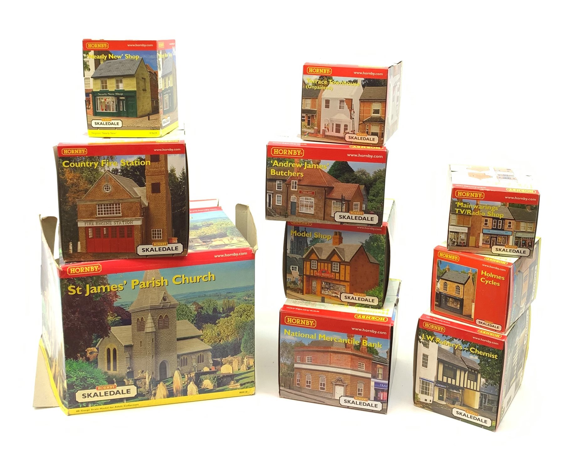 Hornby Skaledale - ten various buildings including St. James' Parish Church, Country Fire Station, National Mercantile Bank, 'Andrew James' Butchers, Model Shop, J.W. Rubery's - Chemist, Holmes Cycles etc, all boxed