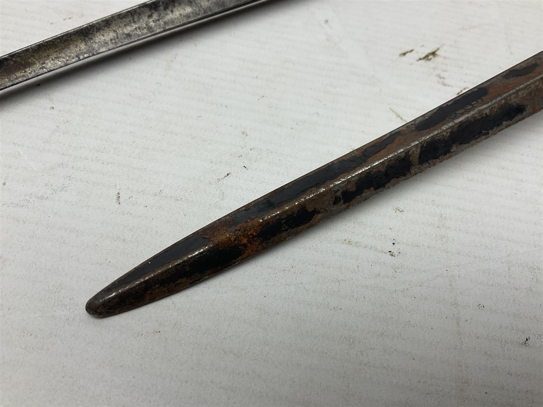 Early 19th century British Brown Bess musket rifle socket bayonet with zigzag fitting stamped D71 and triangular blade stamped 270 L55cm overall; and two other 19th century socket bayonets; no scabbards (3)