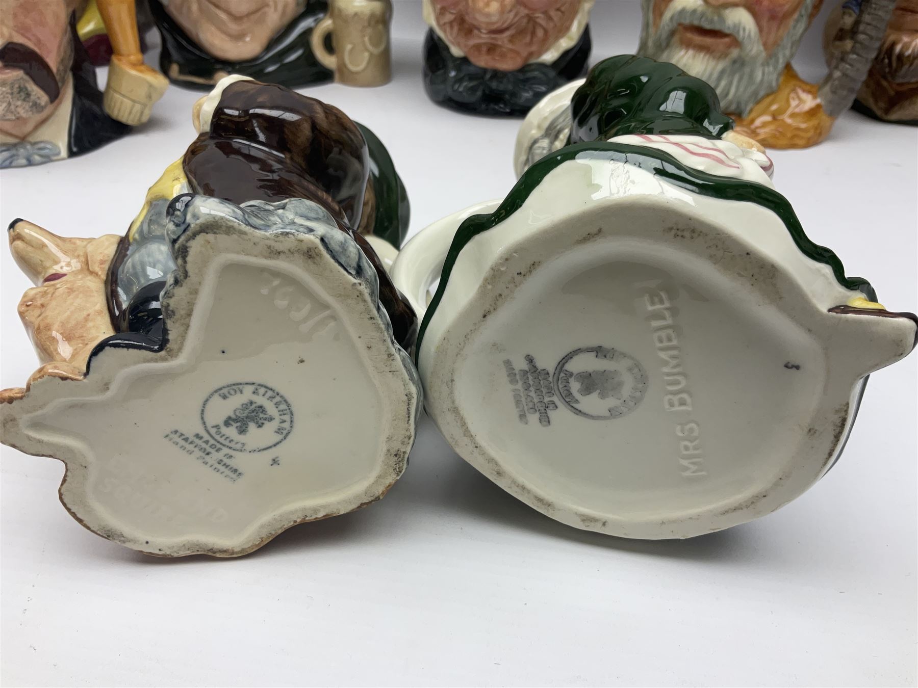 Large collection of Royal Doulton character jugs, to include Robinson Crusoe D6532, Tam O Shanter D6632, The Falconer D6533 etc, together with similar charater jugs and toby jugs   