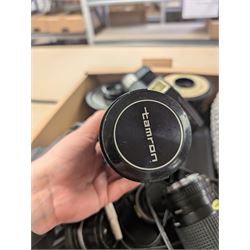 Collection of camera lenses, including Tamron, Praktica, Minolta and Soligor examples