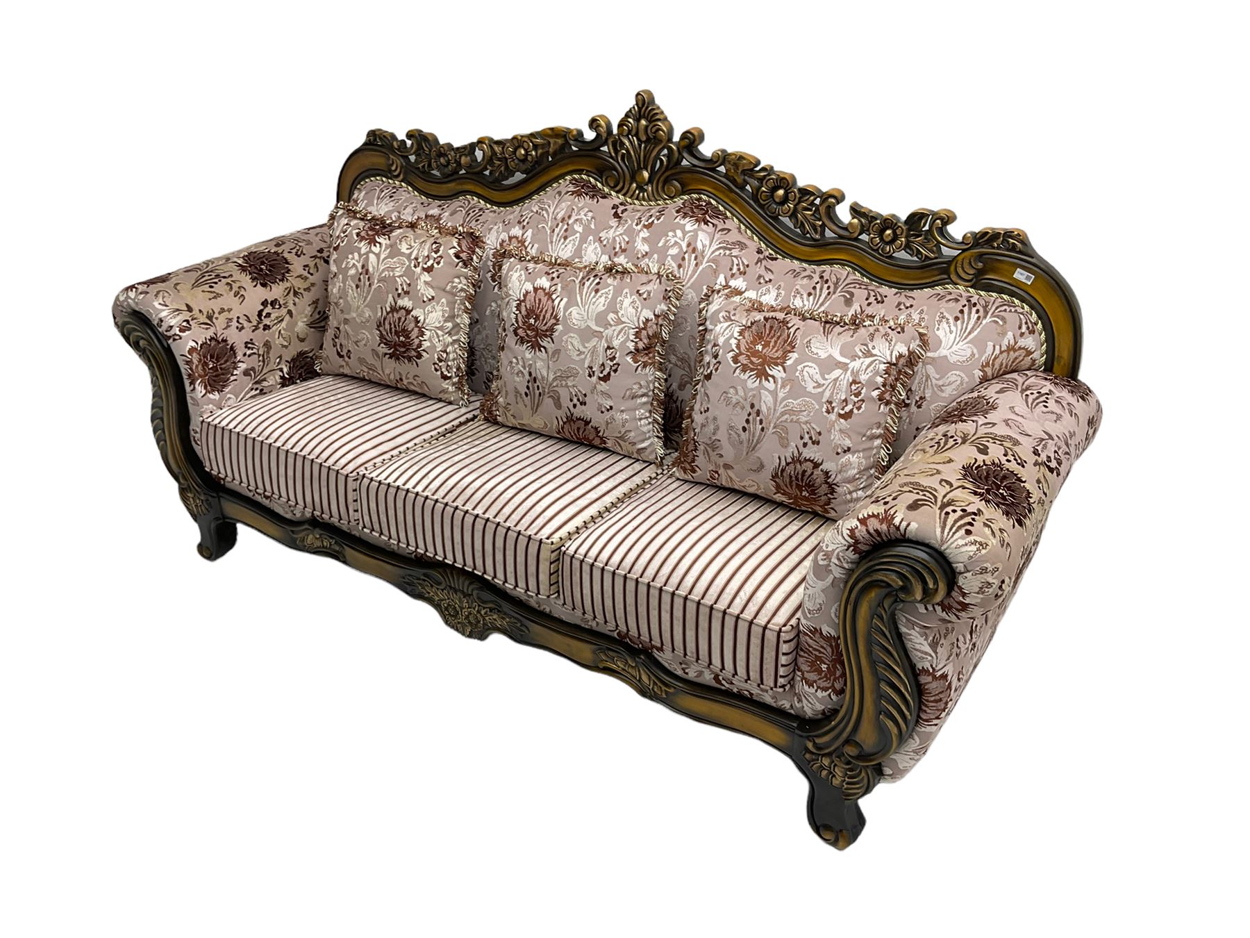 Italian Baroque design three seat sofa, hardwood framed, the cresting rail carved and pierced with c-scrolls and flower heads, scrolled arms, upholstered in floral patterned and striped fabric, with scatter cushions 