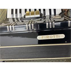 GDR Firotti piano accordion with black and silver case, sixteen keys and forty-eight buttons L38cm; in simulated reptile skin case with sheet music