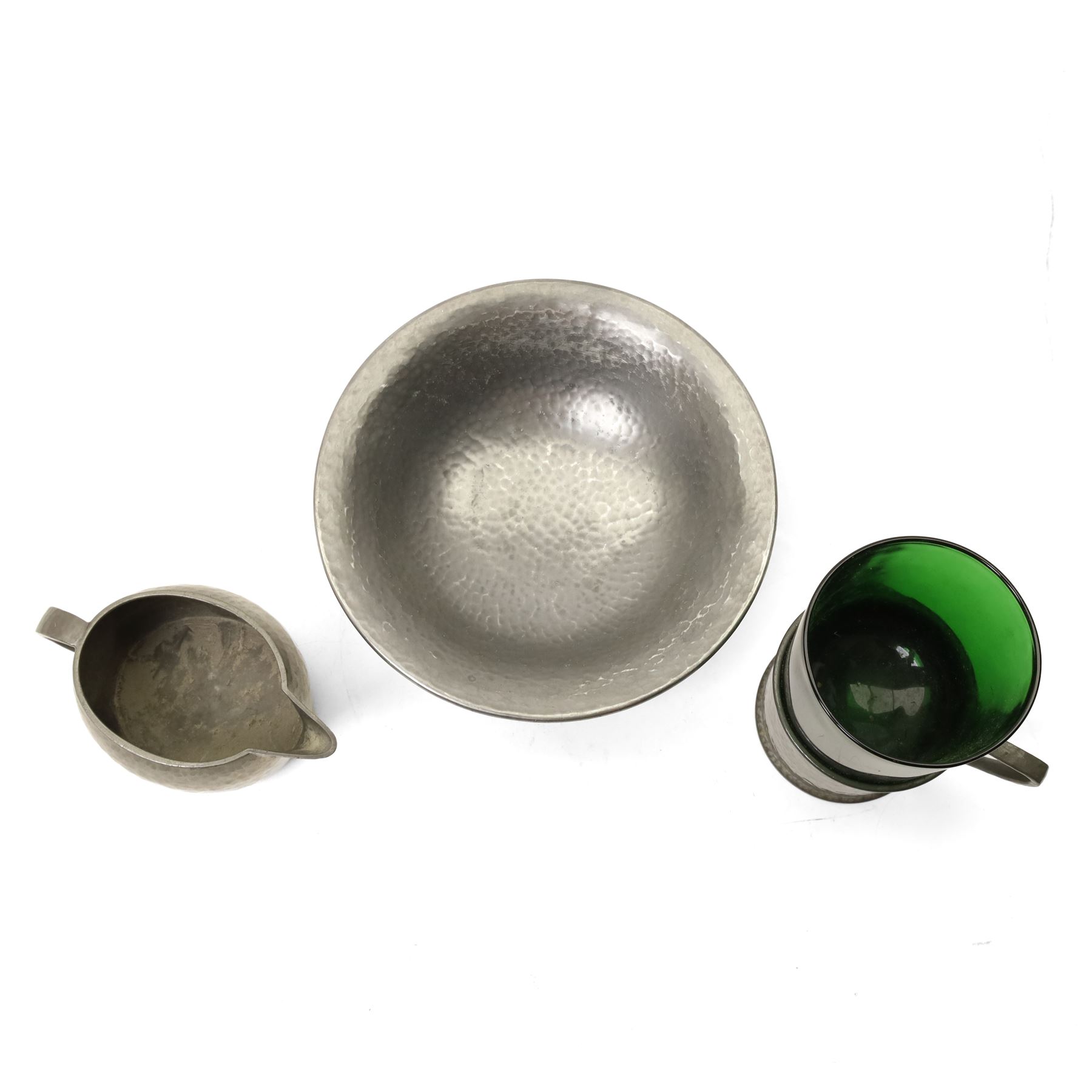 Quantity of Tudric pewter including small hammered pedestal bowl, milk jugs, sugar bowls etc and a WMF dish with Dutch figures No261